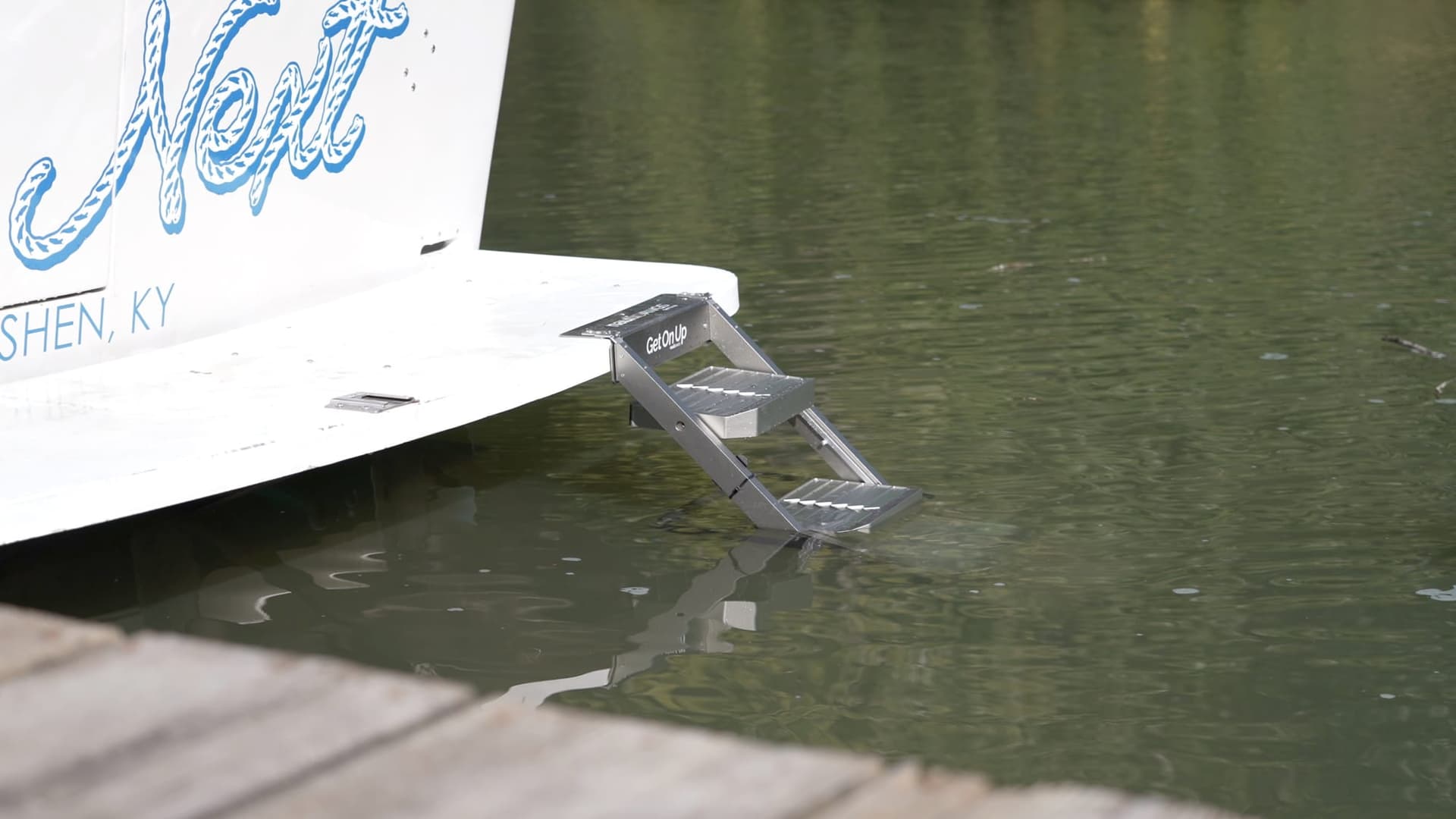 The ladder mounted and deployed off a swim platform