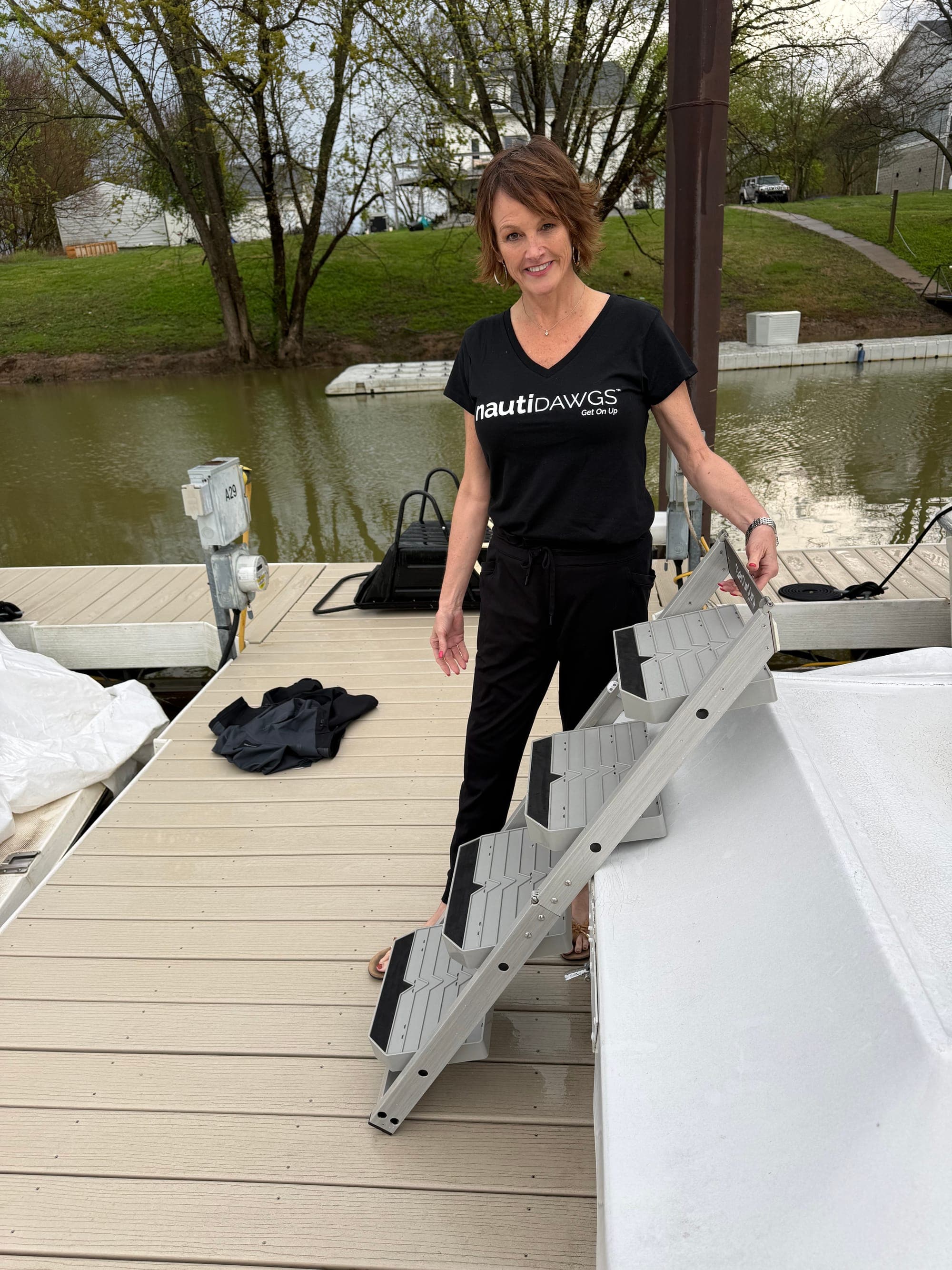 The nautiDAWGS ladder folded flat, showing the four grip-tread steps